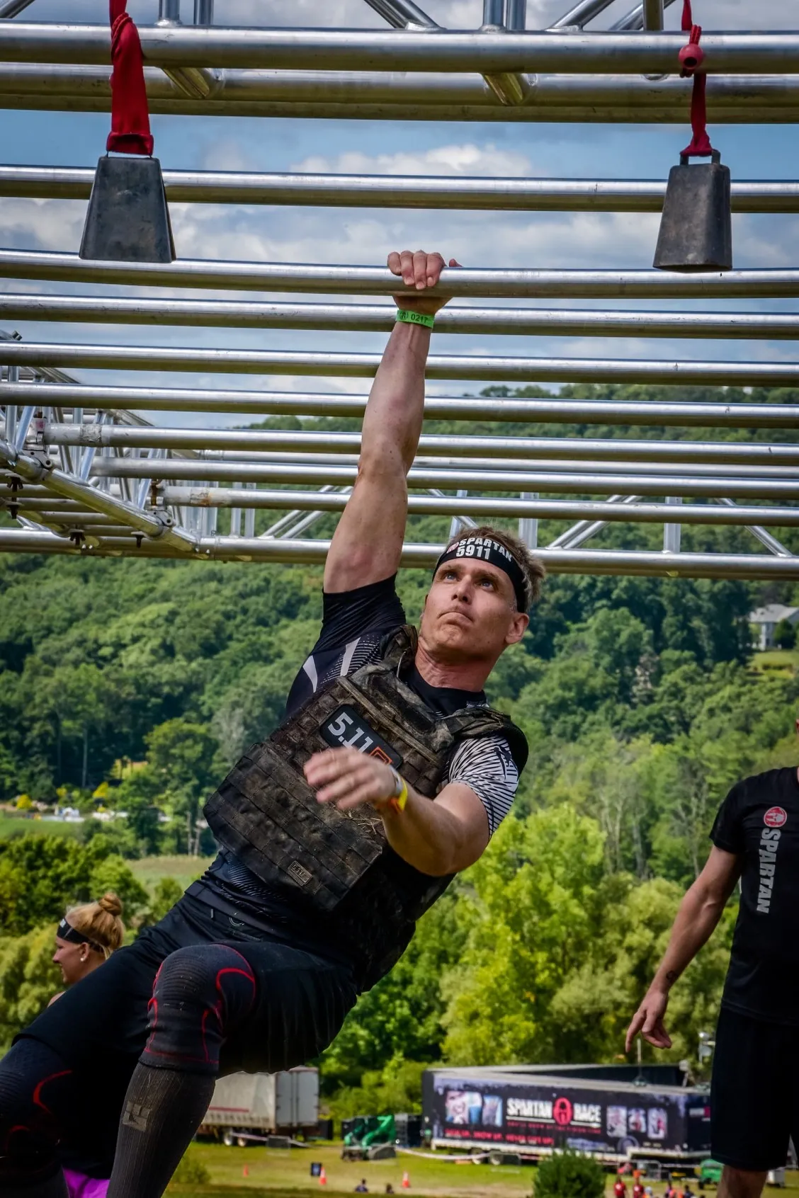 Brian Johnson standing with a scenic mountain backdrop