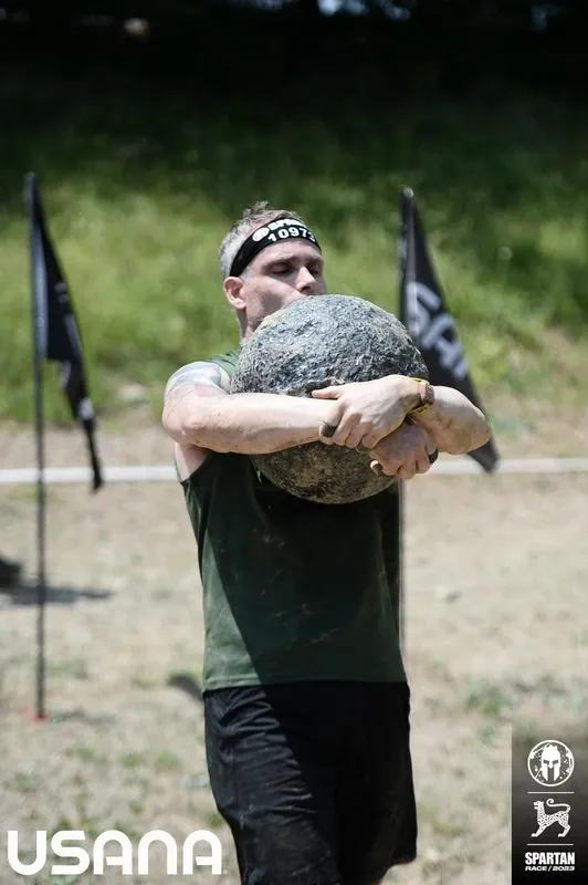 Brian Johnson running through Spartan obstacle course